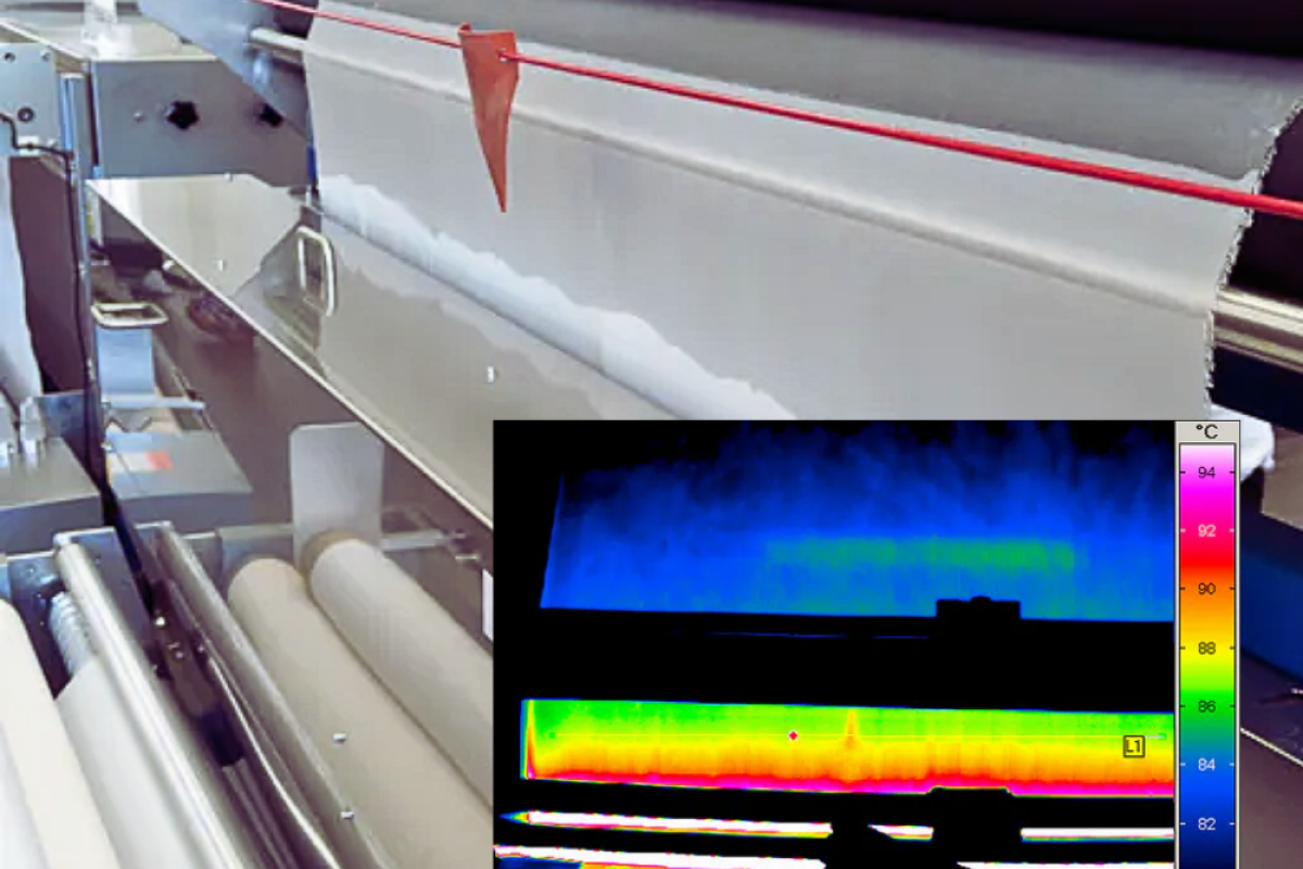 Thin film on a roll in an industrial setting with overlay image of infrared detection of hotspot on film