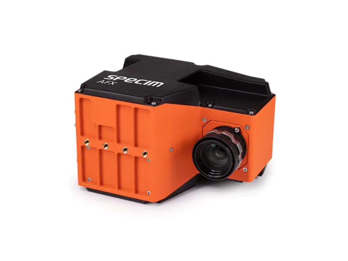 Specim AFX airborne VNIR hyperspectral camera with mounted objective lens sitting on it's side.