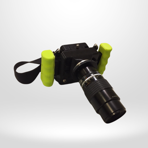 CRIS II cerenkov viewing device with black body, mounted nikon lens, green ergonomic handles and neck strap.
